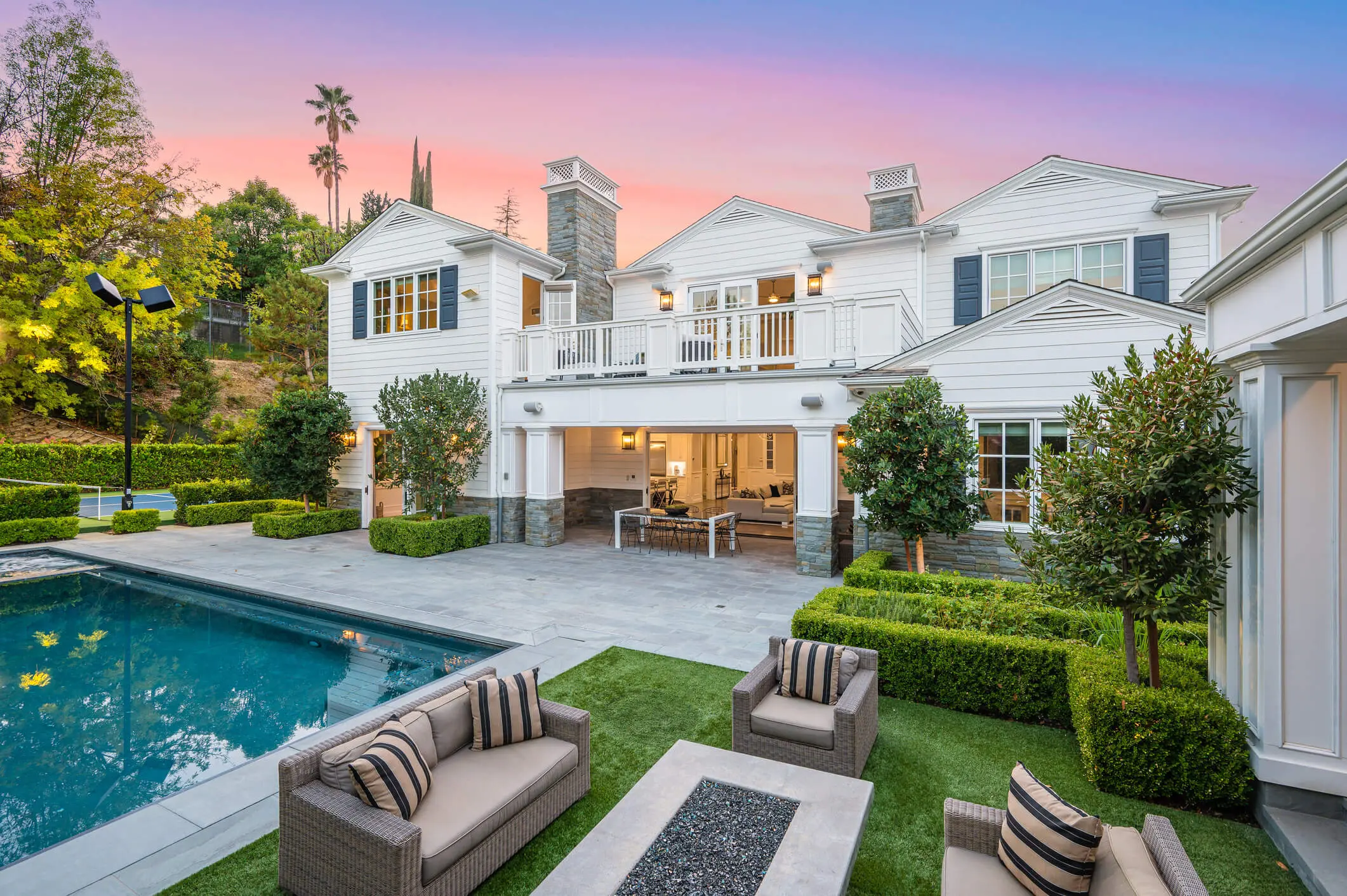 Luxury house with pool and outdoor seating.